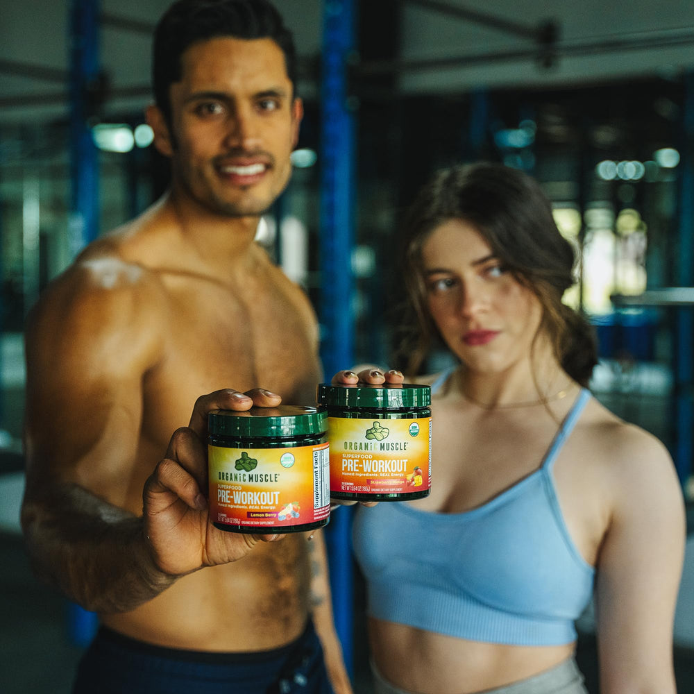 Organic Muscle scoop with glass ready to shake