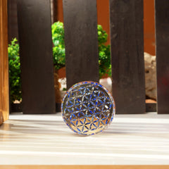 Orgonite Crystal Flower of Life emblem signifies interconnected energy for protection.