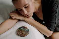 Orgonite Crystal Water Charging Plate shown in a calm room illustrating protective energy.