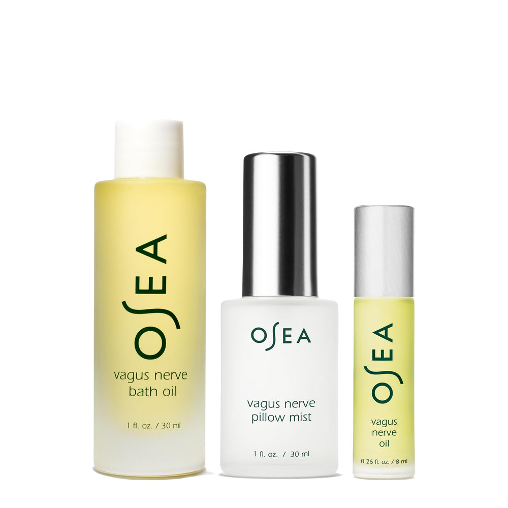OSEA Vagus Nerve Oil application demonstrating circular neck massage for calm evenings.