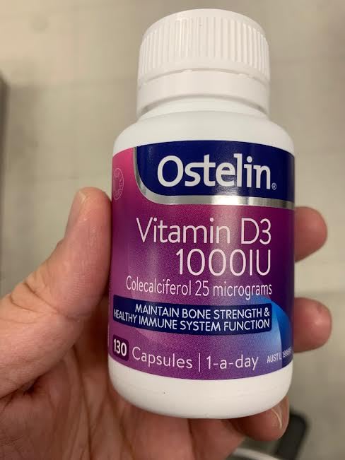 Ostelin Vitamin D3 1000IU bottle and glass shows easy daily intake.