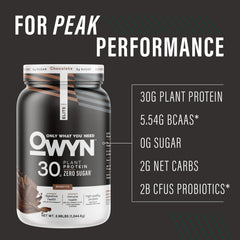 Scoop of OWYN Pro Elite chocolate powder ready to mix into a post-workout drink.