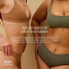Paulina Fitness Reset Daily capsules close-up showing plant enzymes and probiotics that support gut balance.