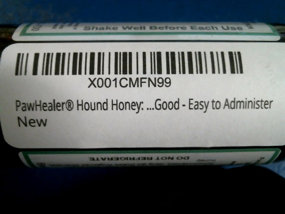 PawHealer Hound Honey dropper ready for dog administration.