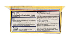 Pepcid AC tablet with glass of water ready for immediate relief.