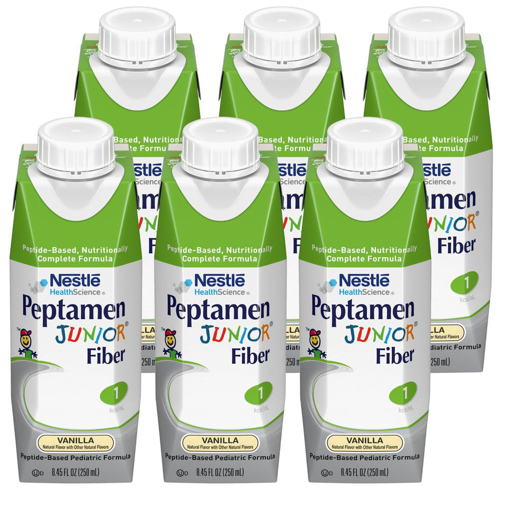 Peptamen Junior Fiber Vanilla powder beside a mixing cup for easy preparation