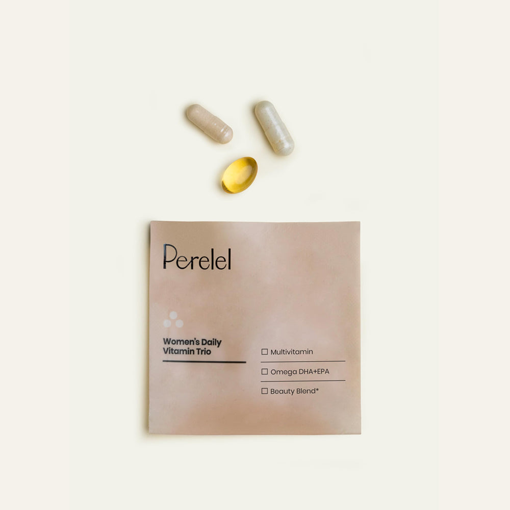 Perelel Daily Pack on-the-go beside a glass of water.