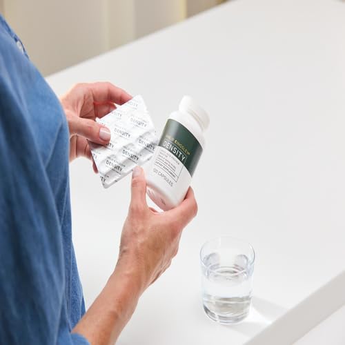 Philip Kingsley Density tablets in hand for easy daily routine.
