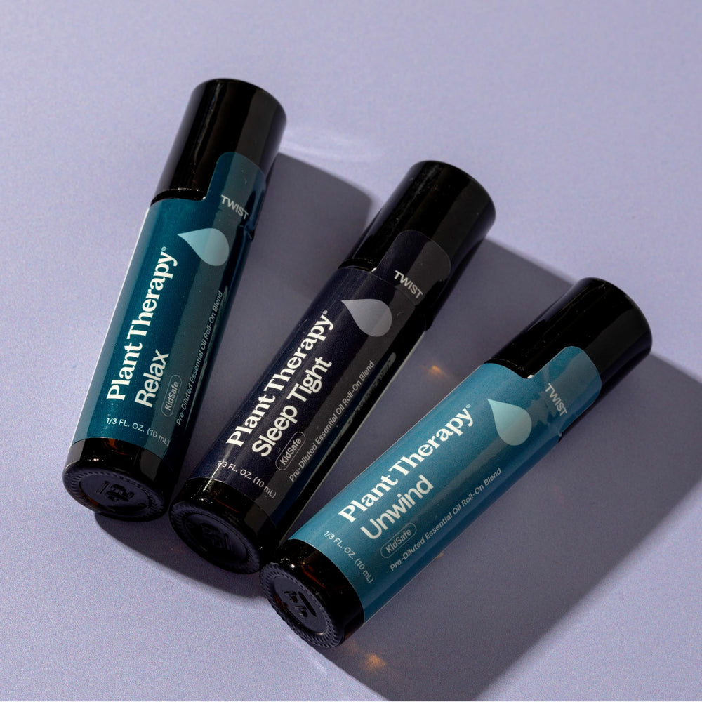 Plant Therapy Sleep Easy trio set displayed on a serene bedside table.