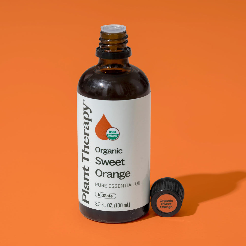 Plant Therapy Sweet Orange oil diluted for skin care rituals and glow.