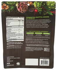PlantFusion Fruitful Greens dissolving in water with a vibrant green hue.