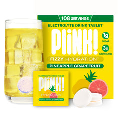 Plink fizzy electrolyte tablets dissolving in water for quick hydration.