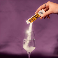 Potion Supernatural Hydration orange powder dissolving in ice-cold water after training