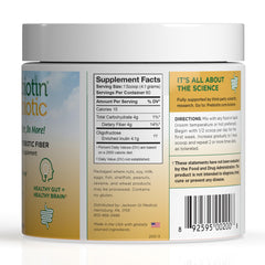 Prebiotin powder scoop beside glass for easy fiber addition
