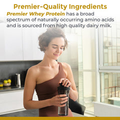 Pouring Premier Organic Whey Protein into water creates a smooth drink.