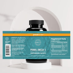 Primal Harvest Omega-3 bottle with glass of water in a daily routine setting