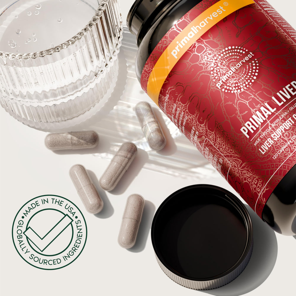 Primal Harvest Primal Liver bottle with capsules resting beside a spoon.