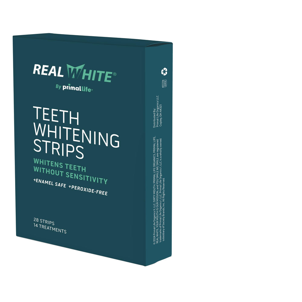 Primal Life Real White Strips packaging highlighting all-natural whitening for on-the-go use.