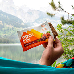 Texture shot of chewy bite and fruit pieces for on-the-go satisfaction.