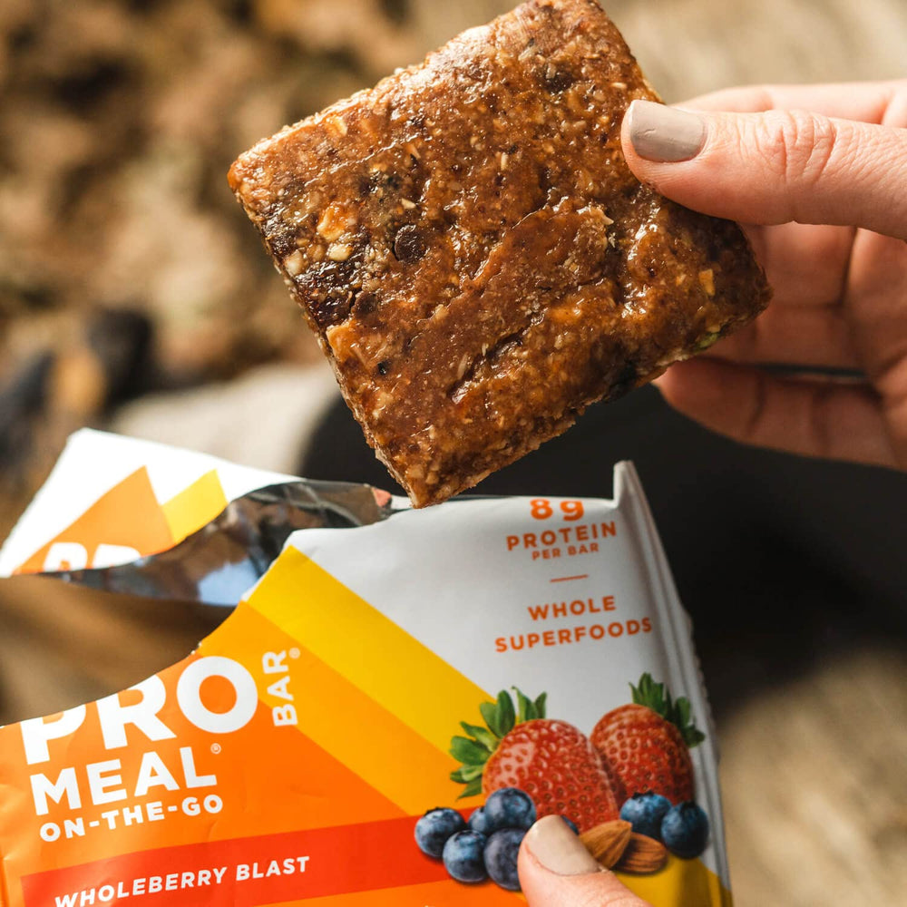PROBAR MEAL Bar Wholeberry Blast on a desk, convenient snack for work.