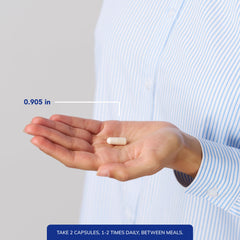 Pouring capsules into a hand, illustrating simple daily administration