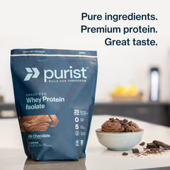 Close-up label of PURIST REP Whey Vanilla highlighting grass-fed ingredients.