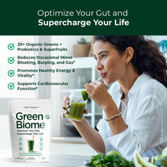 Purity Products Green Biome apple-flavored powder in a glass ready for a smoothie.