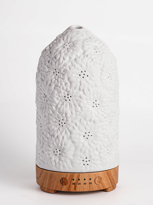 QCYBDGLOV Sunflower ceramic diffuser top view releasing soft ambient fragrance.