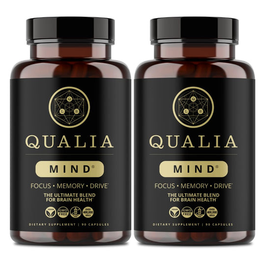 Qualia Mind bottle closeup shows premium nootropic blend for focused energy.