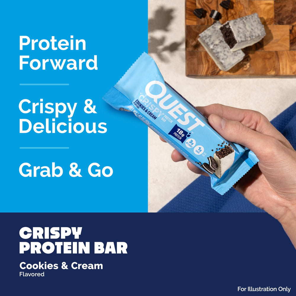 In-hand shot of Quest Cookies & Cream Crispy Bar for on-the-go protein.