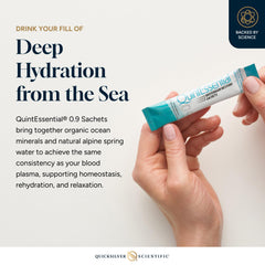 Quicksilver Quintessential 0.9 sachet being stirred into water for balanced mineral replenishment.