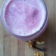 Raw Organic Whey scoop beside powder, keto-friendly and gluten-free option.