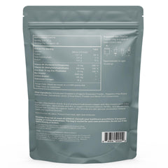 Glass with dissolved powder and straw showing neutral mixing from Reset Wellness