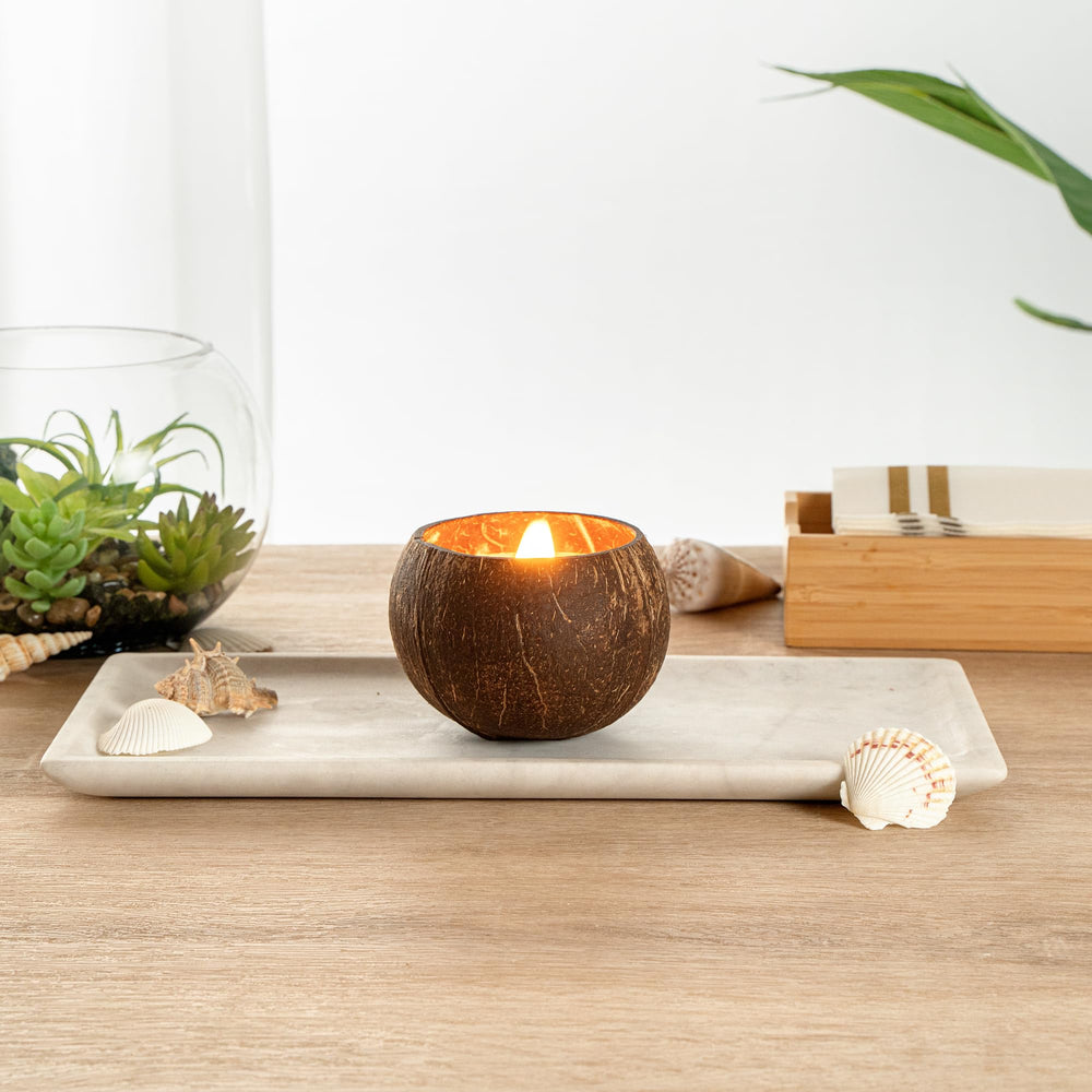 Restaurantware Coco Casa close-up of coconut shell candle showing natural, handmade charm.
