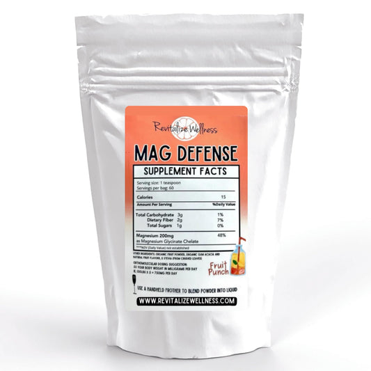 Revitalize Wellness Mag Defense powder with a teaspoon scoop for easy daily magnesium support