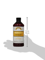 Rooster Booster B-12 Liquid pour shows easy daily poultry nutrition management.