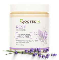 Rooted In Rest magnesium lotion bottle ready for night-time use.
