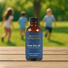 Rooted Intuition Low Key Jr bottle being poured for calm focus