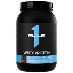 Rule 1 Whey Protein bottle pour shows convenient serving for post-workout energy and flavor