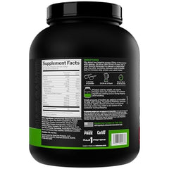 Rule1 Mass Gainer shake being poured into a glass to fuel workouts.