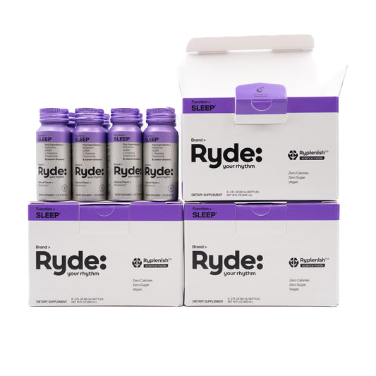 RYDE Sleep 2oz bottle on nightstand for quick relaxation.