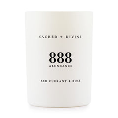 Sacred + Divine 888 abundance candle label close-up for mindful intention setting.