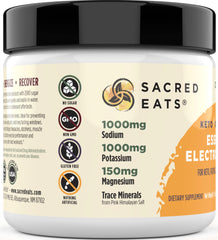 Sacred Eats Mango electrolyte powder dissolving in water for quick, sugar-free hydration.