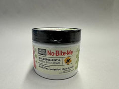 Close-up of No Bite Me cream being dabbed on skin for itch relief.