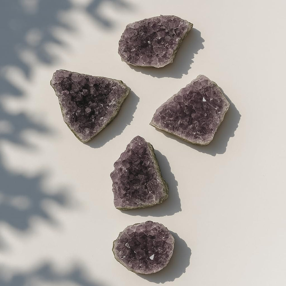 SAMSARI amethyst geode closeup reveals sparkling crystals for serene space energy.