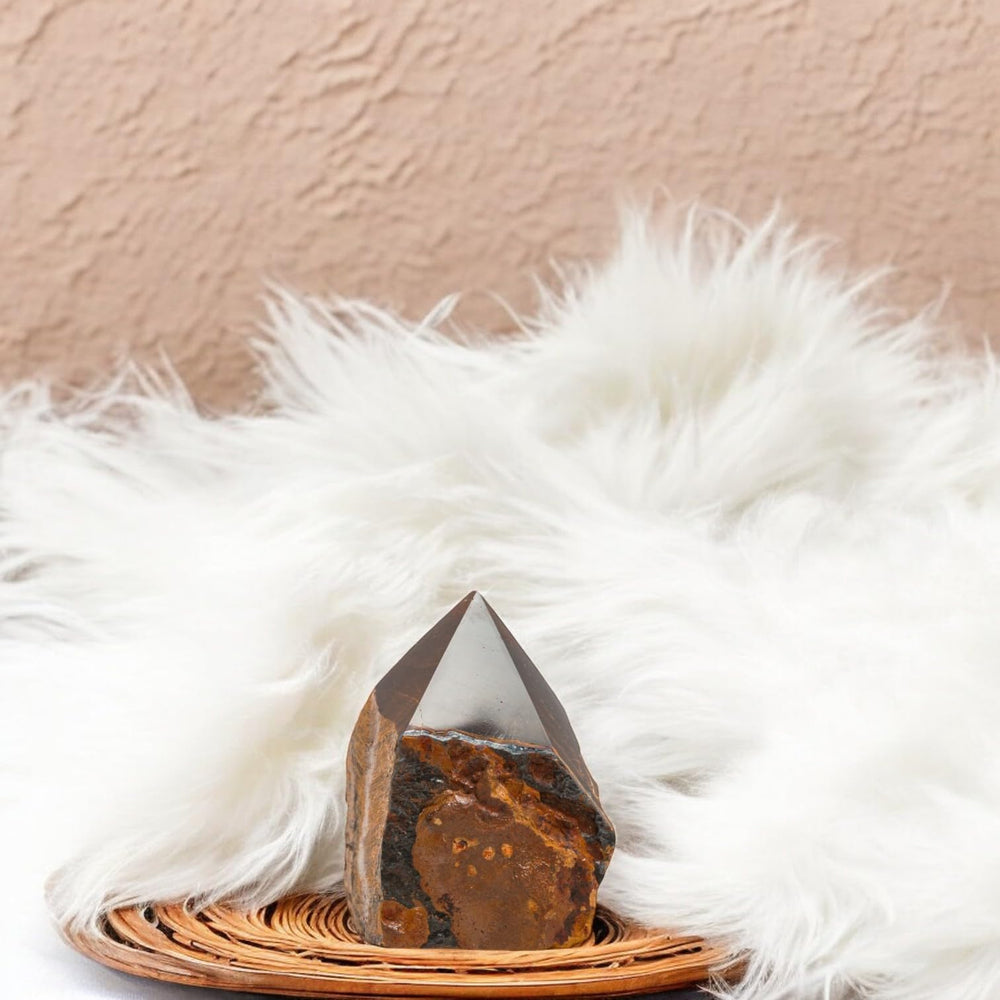 SAMSARI Tiger Eye crystal-point aids meditation focus and balance.