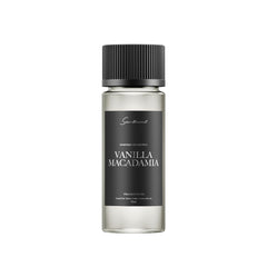 Scentiment Vanilla Macadamia diffuser oil bottle boosts cozy room ambience.