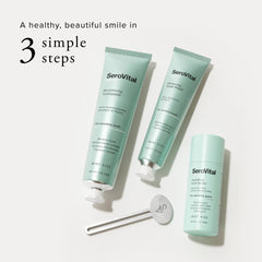 Hands applying Serovital Smile Serum as part of nightly oral care.