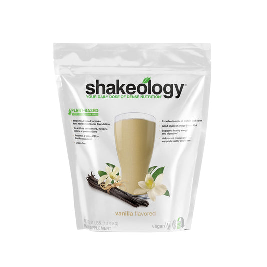 Shakeology Vanilla bottle close-up showing plant-based protein blend.