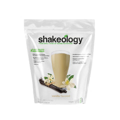 Shakeology Vanilla bottle close-up showing plant-based protein blend.